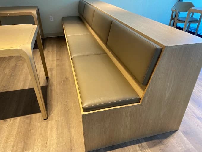 Custom oak banquette with taupe leather cushions