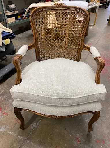 French provincial armchair with cane back and new upholstery