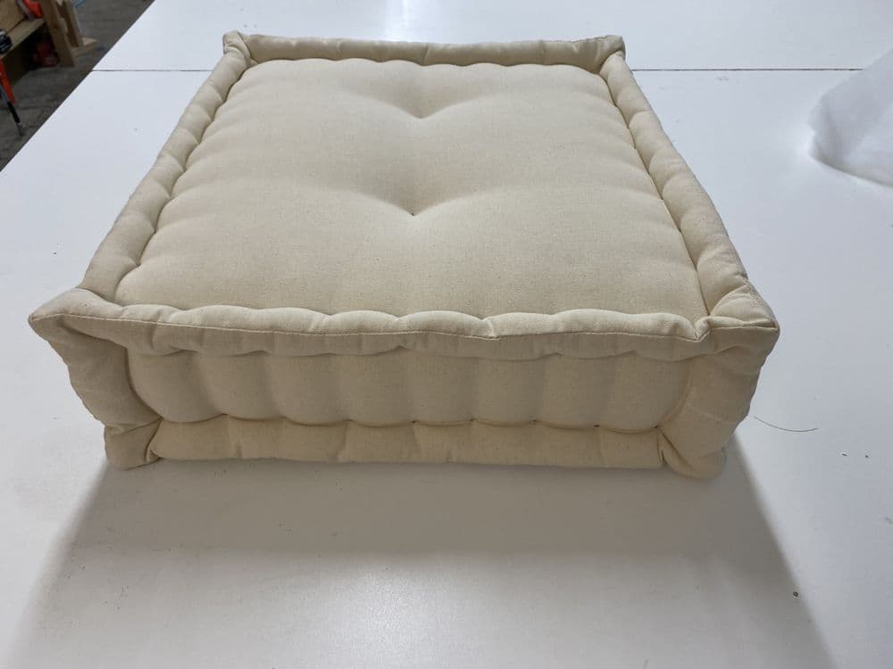 Hand-tufted cream canvas French floor cushion with boxed edges